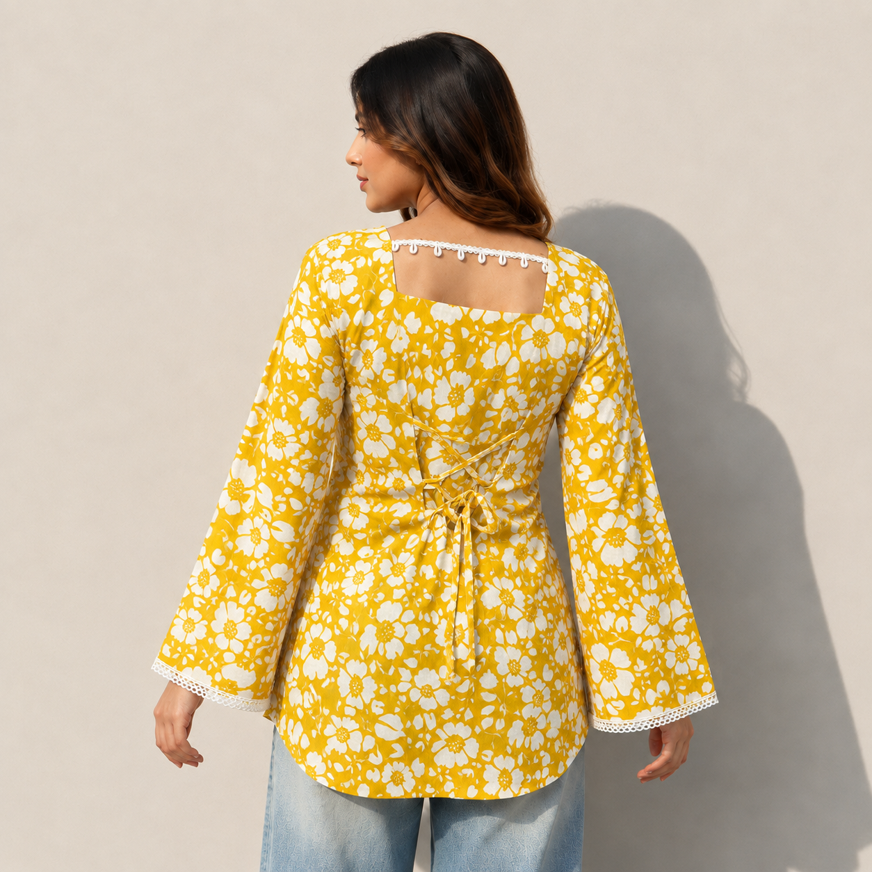 Women Floral Printed Yellow Short Kurti with Square Neck, Full Bell Sleeves, Back Dori, Kodi & Lace Detailing | Stylish Ethnic Tunic for Women